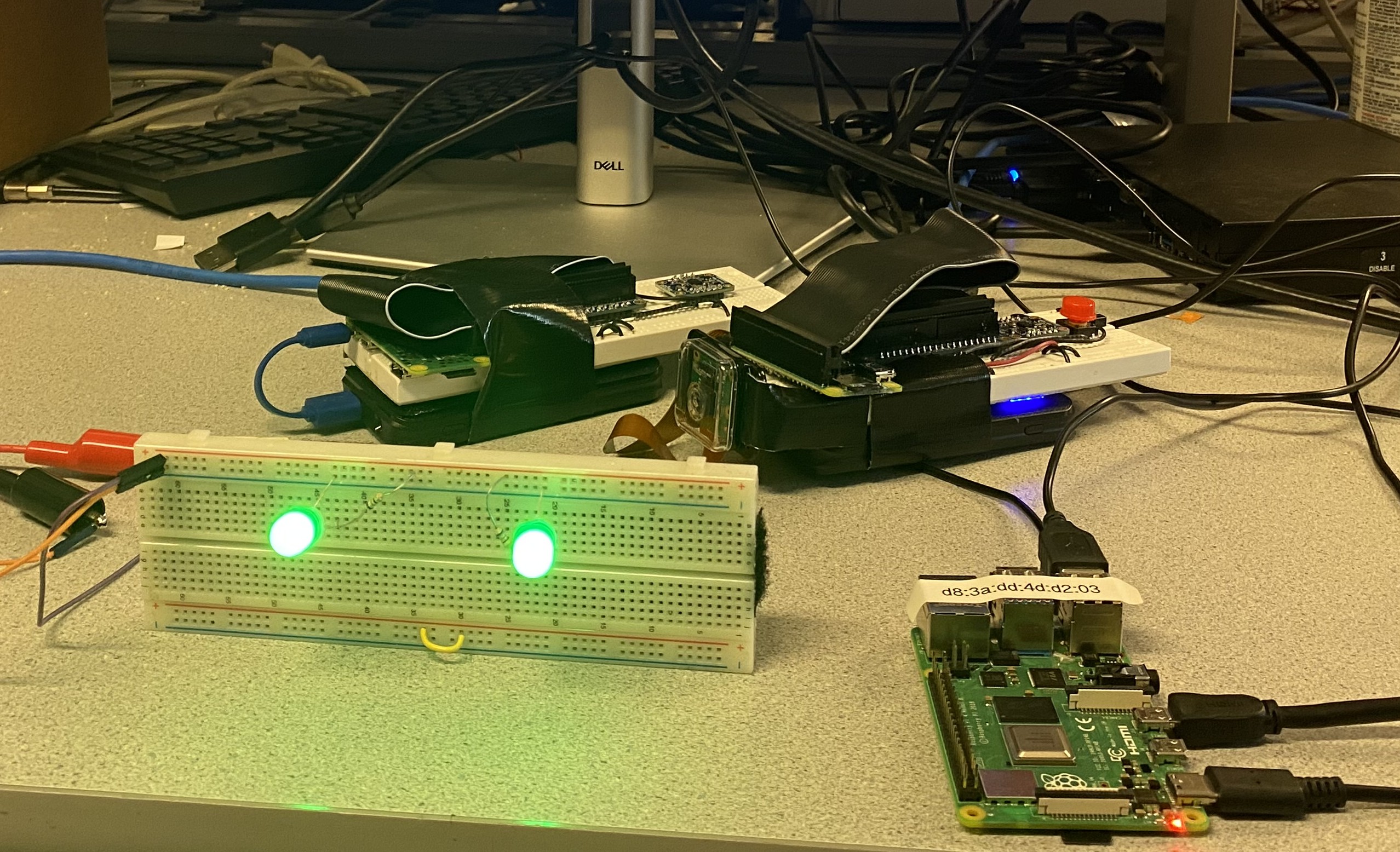 Remotes, console, and sensor bar that make up the RPi Wii